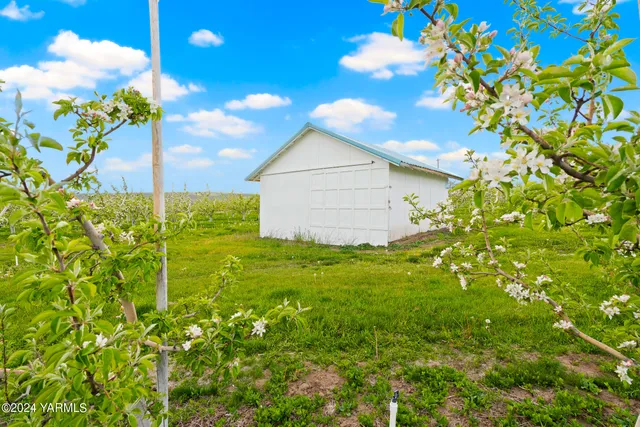 a view of backyard with deck and outdoor seating