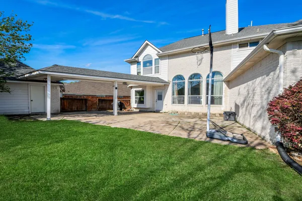 a front view of a house with a yard and porch