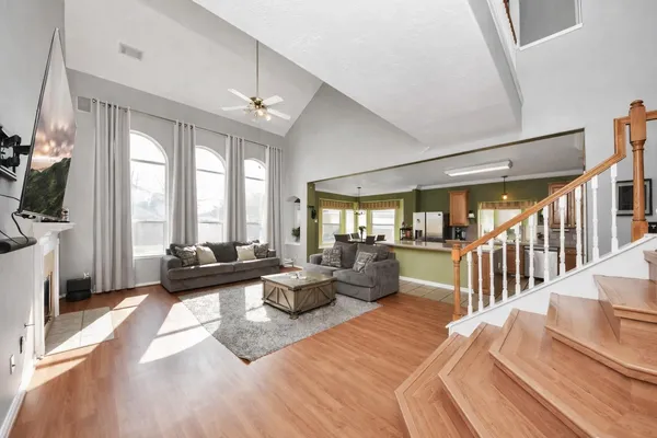 a living room with furniture fireplace and flat screen tv