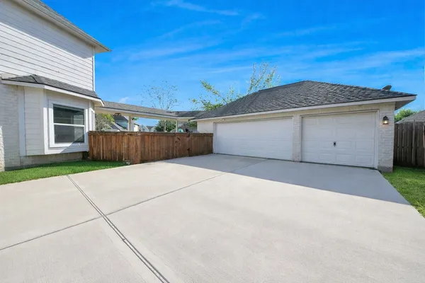 a view of garage and yard