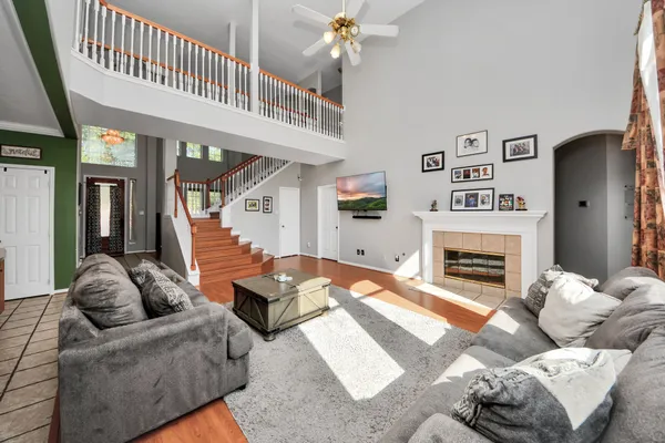 a living room with furniture and a fireplace