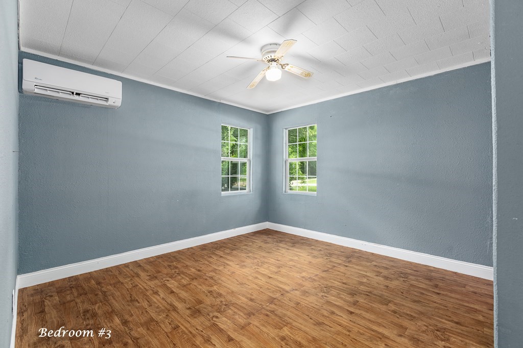 2915 Freeman Street Lufkin, TX 75901 - Photo 24 of 33 wooden floor in an empty room with a window
