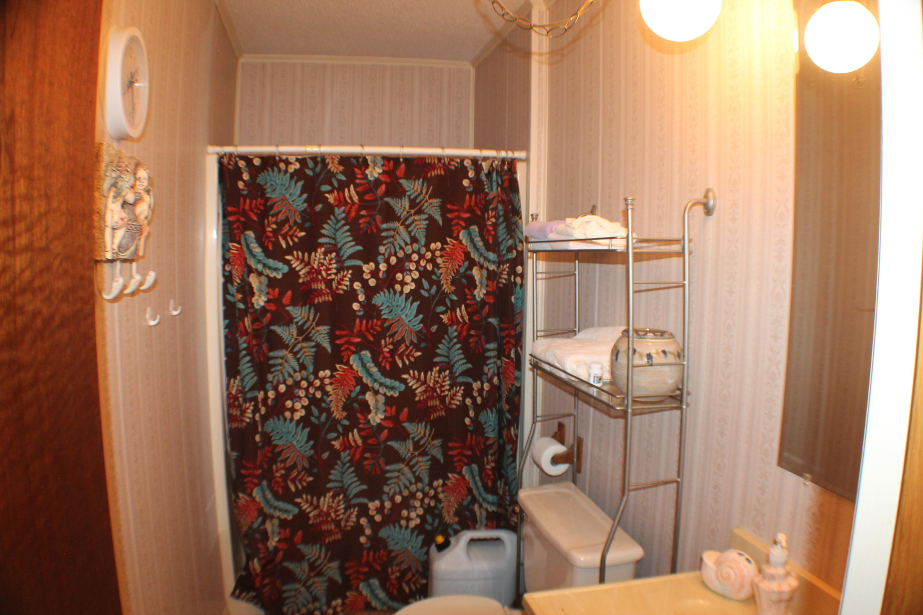 1875 Middle Creek Road Wing, AL 36483 - Photo 19 of 24 a bathroom with a sink toilet and shower