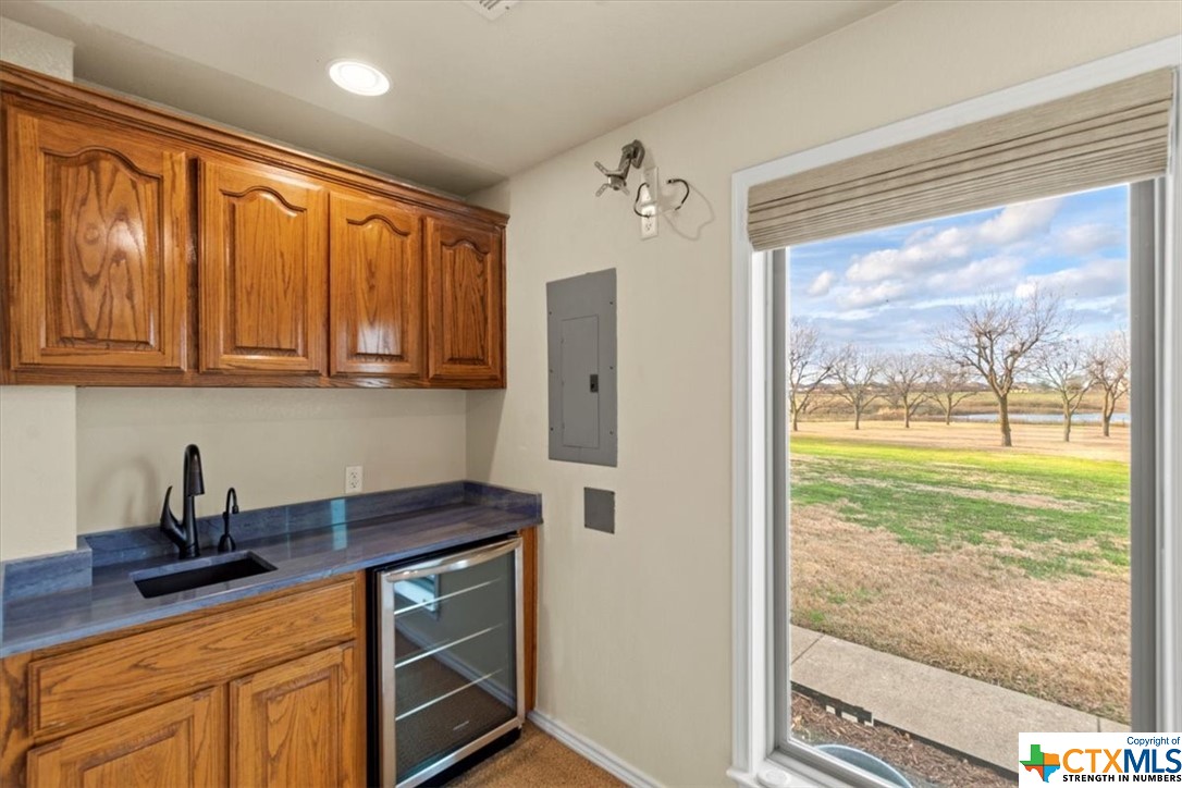 6503 Wells Fargo Road Killeen, TX 76542 - Photo 27 of 48 a kitchen with stainless steel appliances granite countertop a refrigerator sink and cabinets