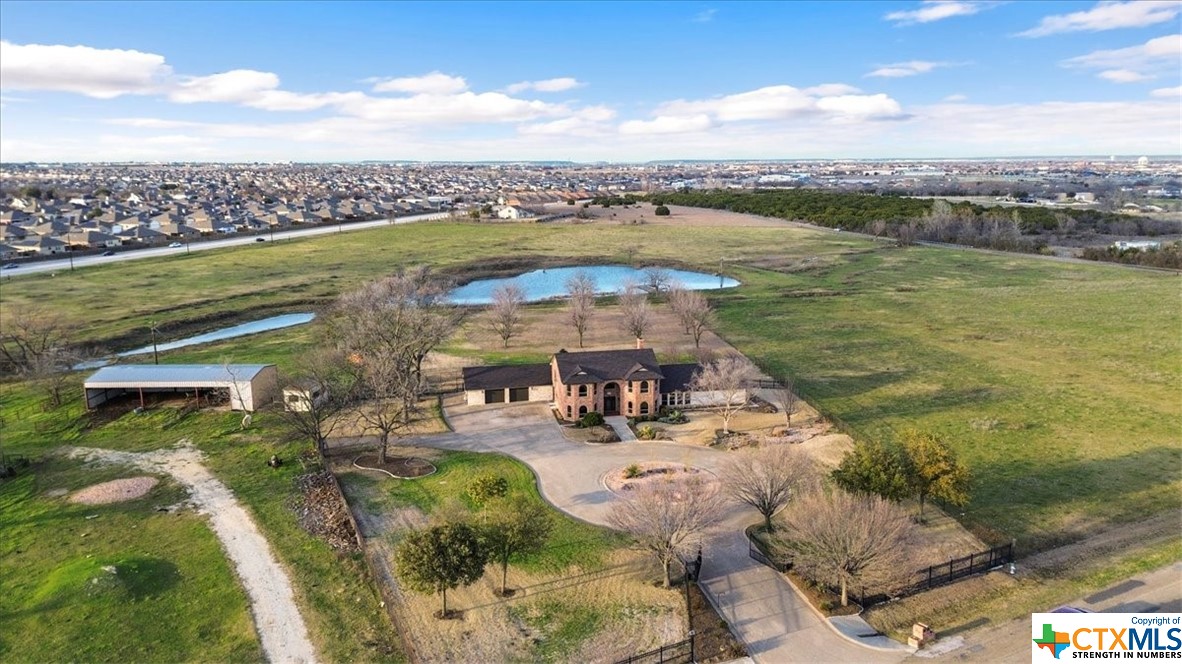 6503 Wells Fargo Road Killeen, TX 76542 - Photo 3 of 48 a view of a lake with a terrace with outdoor seating