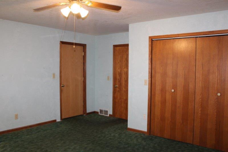 11700 Lincoln Road Morrison, IL 61270 - Photo 22 of 45 an empty room with chandelier fan