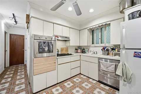 a bathroom with a sink mirror vanity and toilet