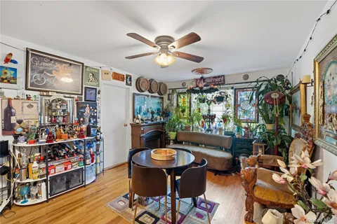 a living room with furniture a rug and a flat screen tv