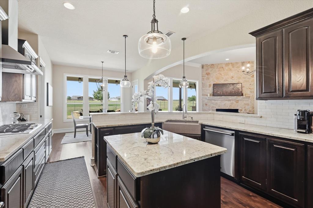 4920 Peden Road Fort Worth, TX 76179 - Photo 9 of 40 Large Kitchen with Updated Lighting, Viking Appliances, and Granite Countertops Overlooking the Dining and Livingroom.