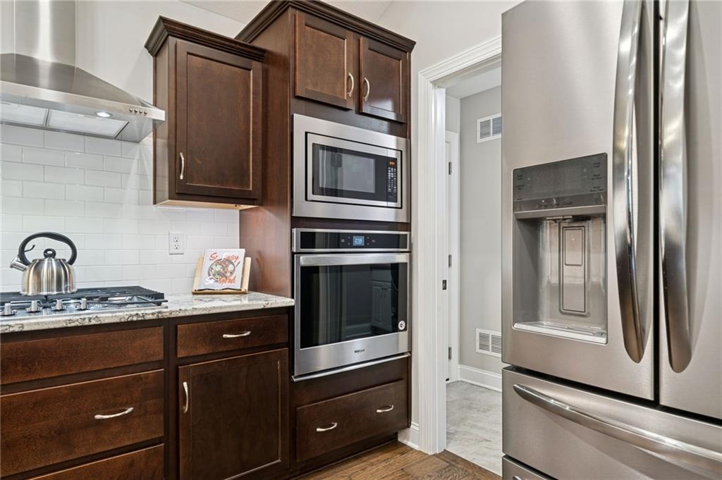 336 Saddlebrook Road Gibsonia, PA 15044 - Photo 16 of 35 a kitchen with granite countertop stainless steel appliances and cabinets