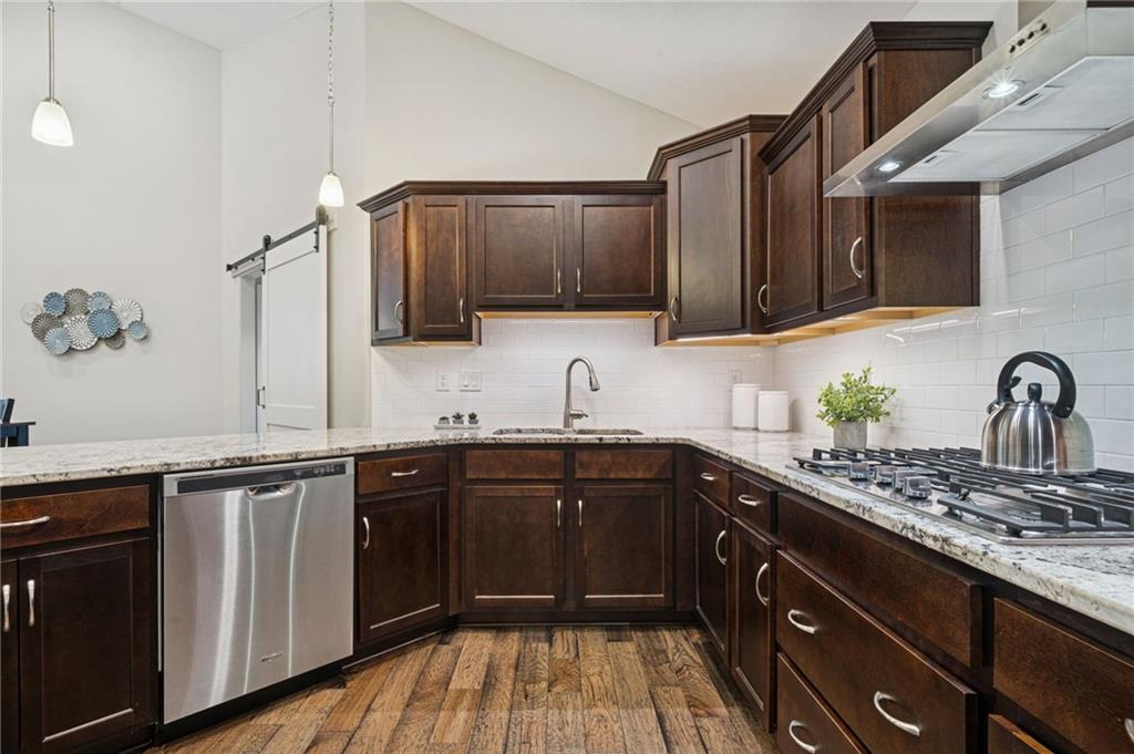 336 Saddlebrook Road Gibsonia, PA 15044 - Photo 17 of 35 a kitchen with a sink dishwasher a stove and cabinets