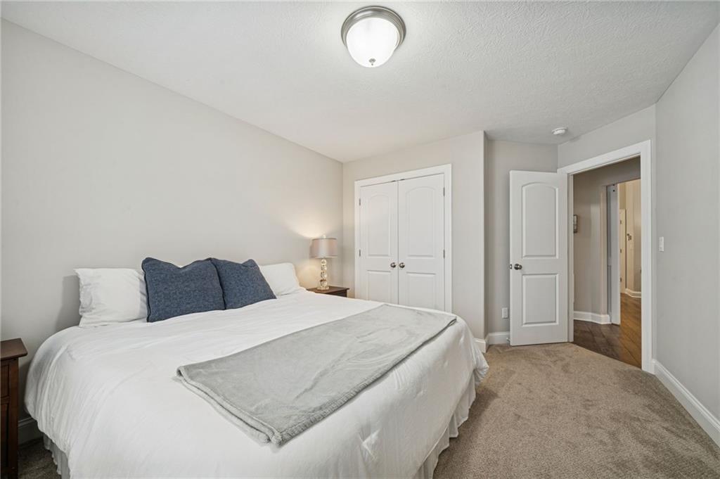 336 Saddlebrook Road Gibsonia, PA 15044 - Photo 27 of 35 a bedroom with a bed and a lamp