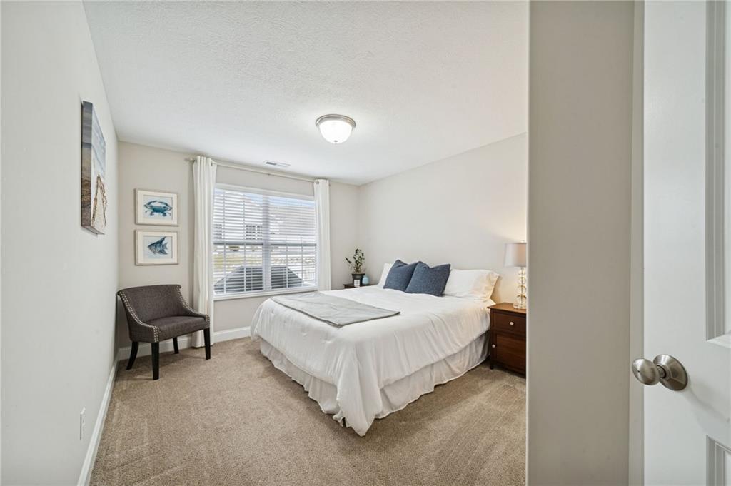 336 Saddlebrook Road Gibsonia, PA 15044 - Photo 29 of 35 a bedroom with a bed and a chair