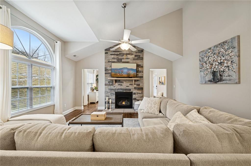 336 Saddlebrook Road Gibsonia, PA 15044 - Photo 7 of 35 a living room with furniture a fireplace and a chandelier