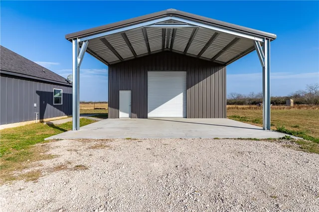 a view of a backyard of the house