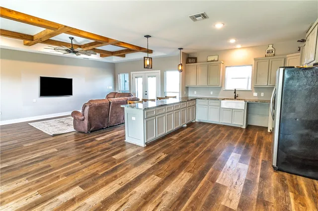 a kitchen with stainless steel appliances granite countertop a stove and a refrigerator