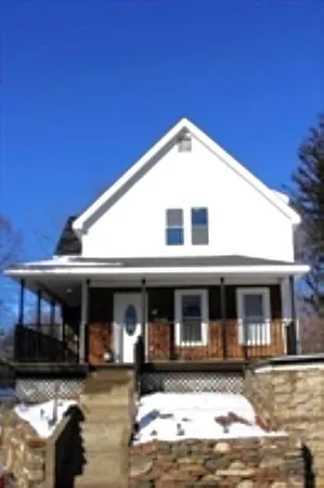 a front view of a house with yard