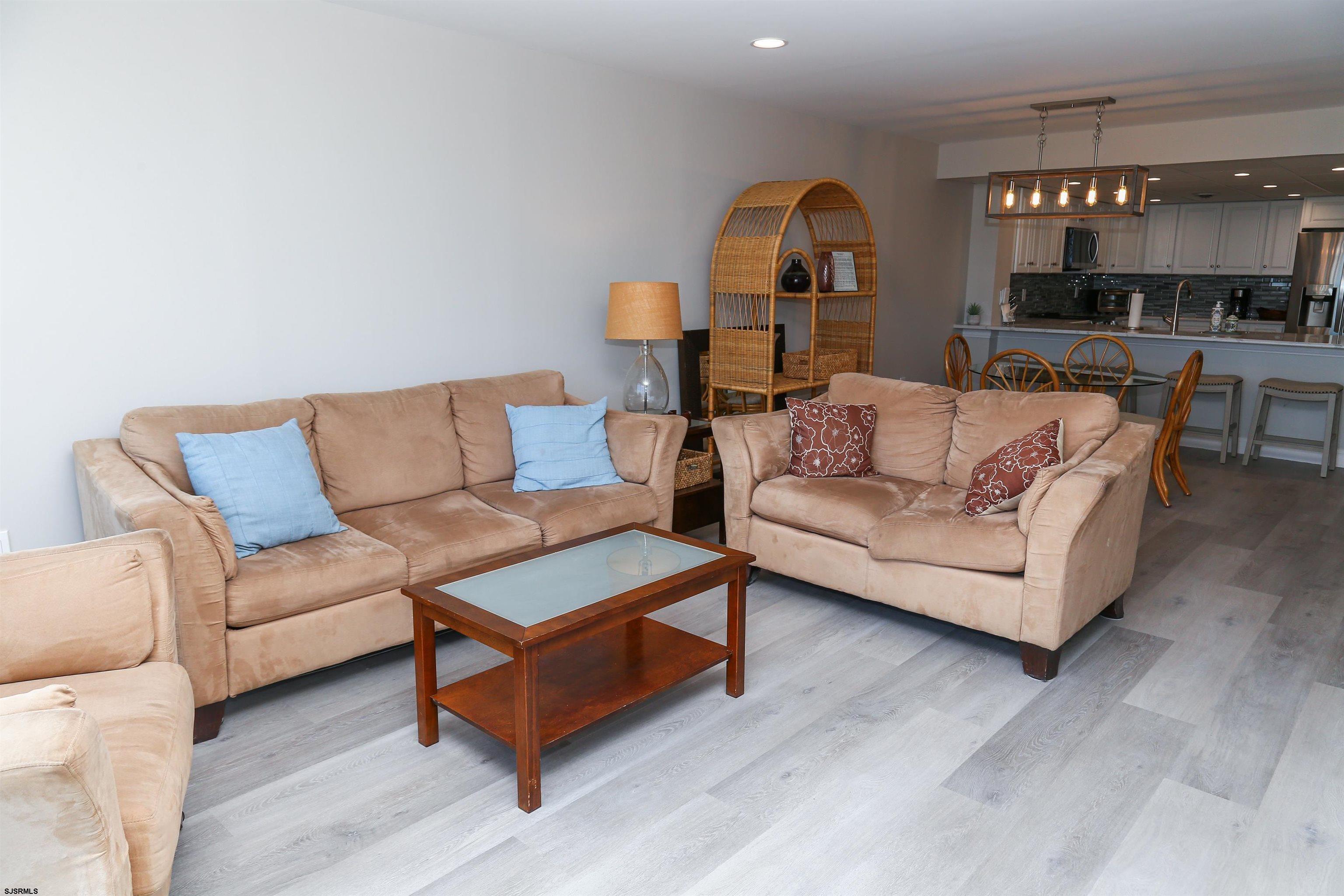 4540 West Brigantine Avenue, Unit N408 Brigantine, NJ 08203 - Photo 17 of 42 a living room with furniture and a wooden floor