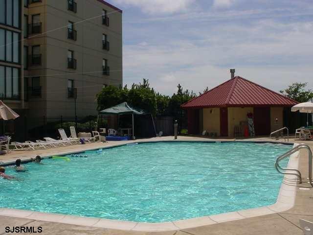 4540 West Brigantine Avenue, Unit N408 Brigantine, NJ 08203 - Photo 2 of 42 a front view of a house with garden