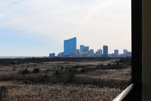 a room with a bed and a dresser in it
