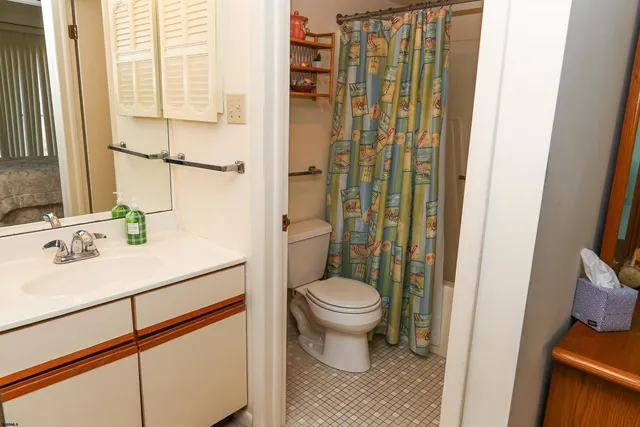 a bathroom with a toilet a sink and a bathtub