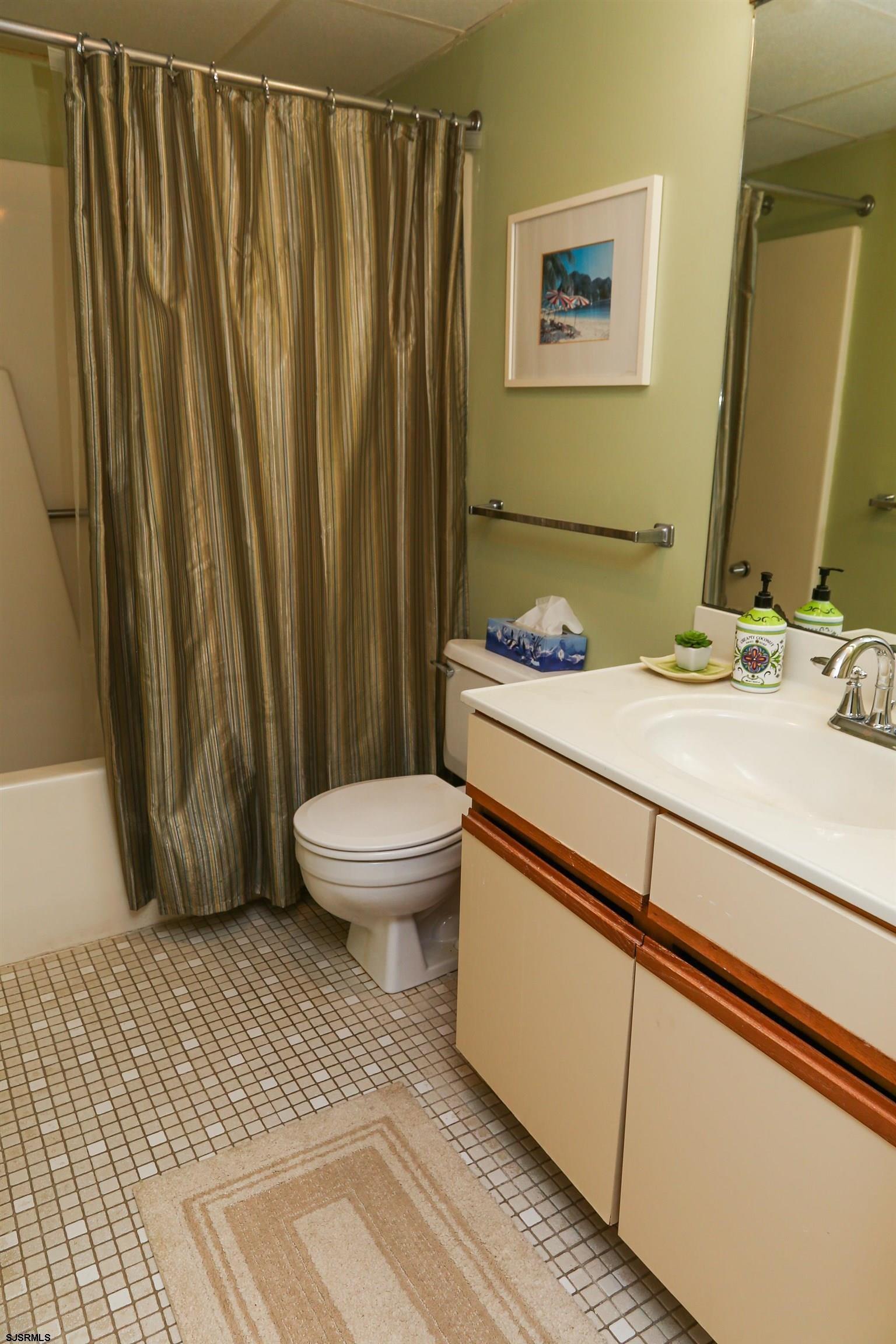 4540 West Brigantine Avenue, Unit N408 Brigantine, NJ 08203 - Photo 35 of 42 a bathroom with a sink toilet and shower