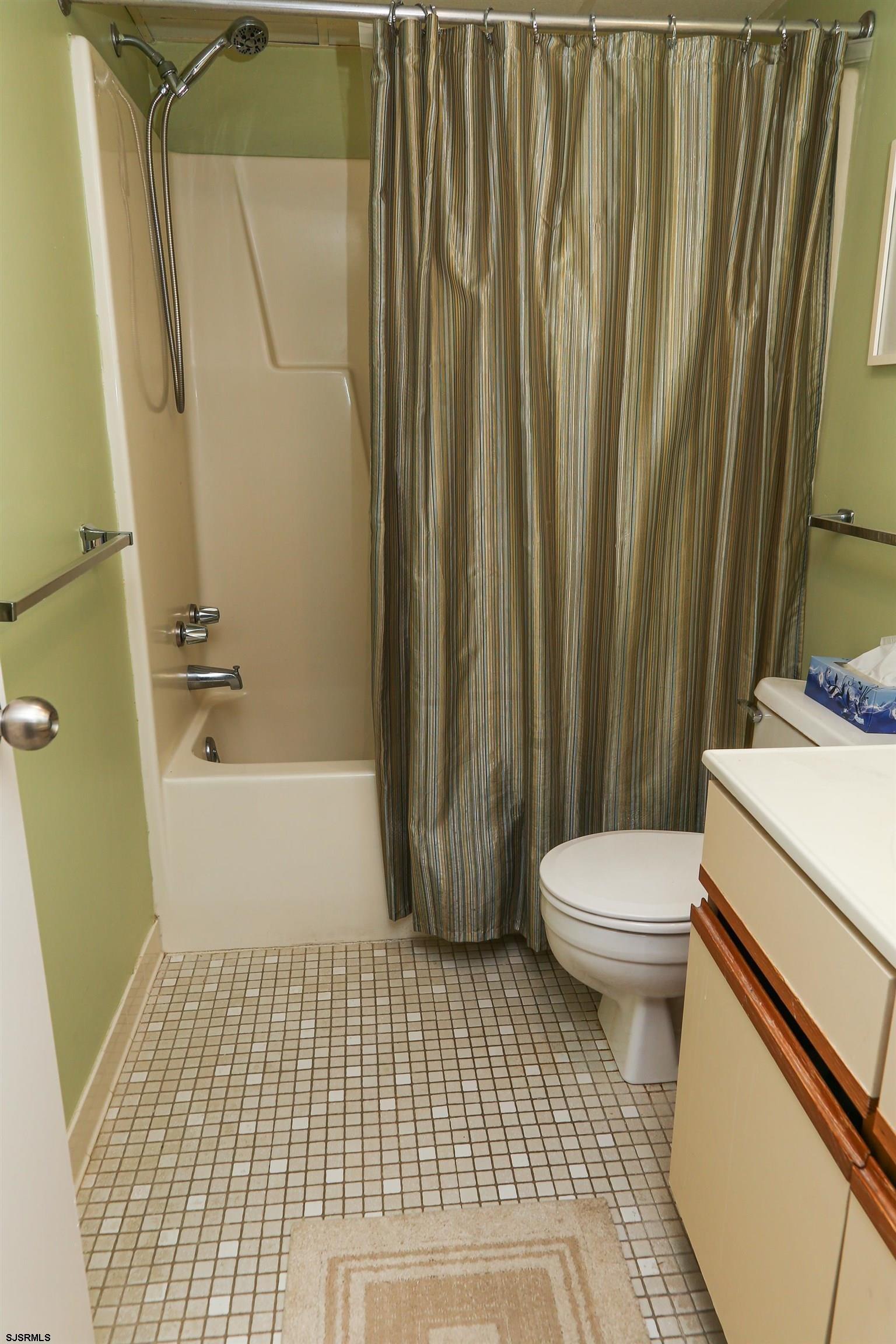4540 West Brigantine Avenue, Unit N408 Brigantine, NJ 08203 - Photo 36 of 42 a bathroom with a toilet a sink and a bathtub
