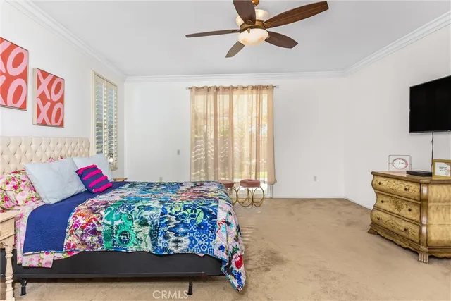 a bedroom with a bed and flat screen tv