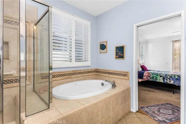 a bathroom with a tub and shower