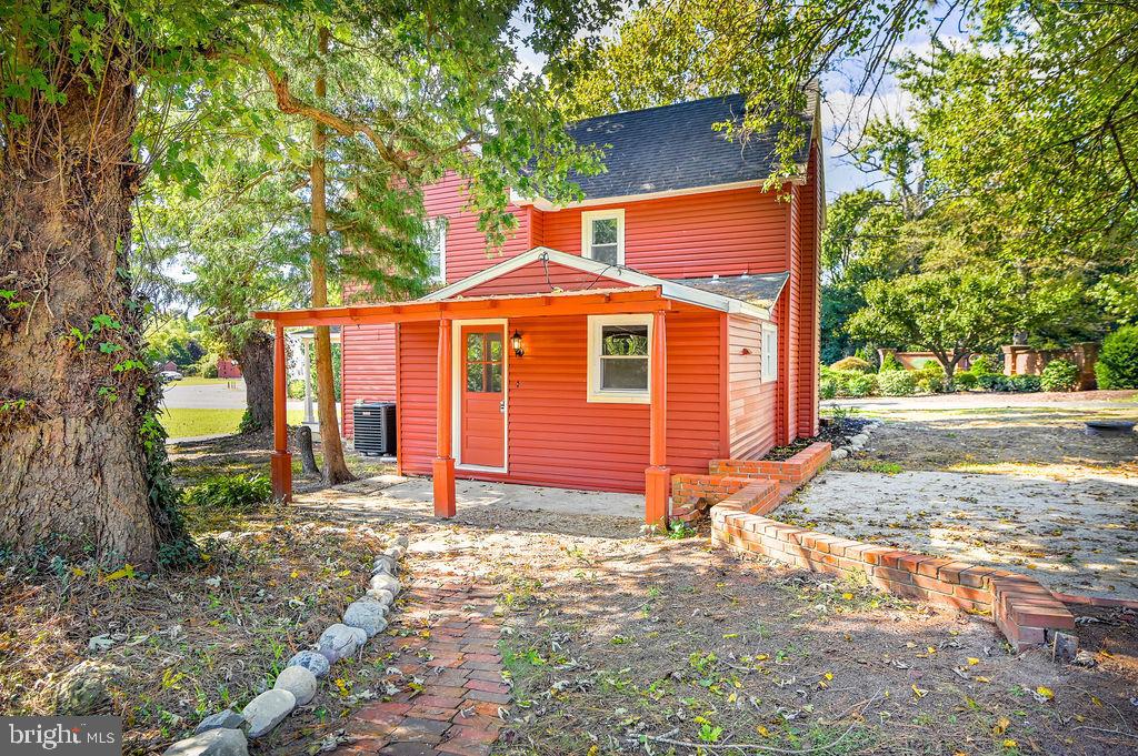 5353 Shad Point Road Salisbury, MD 21801 - Photo 23 of 23 a front view of a house with a yard and garage