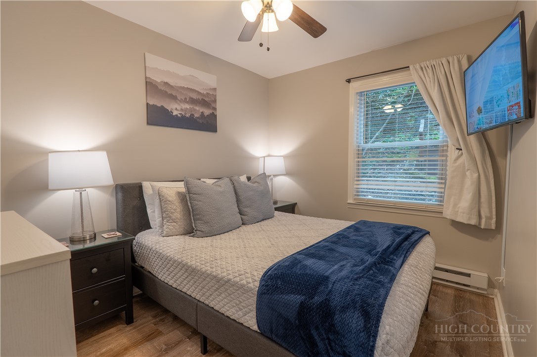 141 Snowflake Road Banner Elk, NC 28604 - Photo 8 of 28 a bedroom with a bed and a window