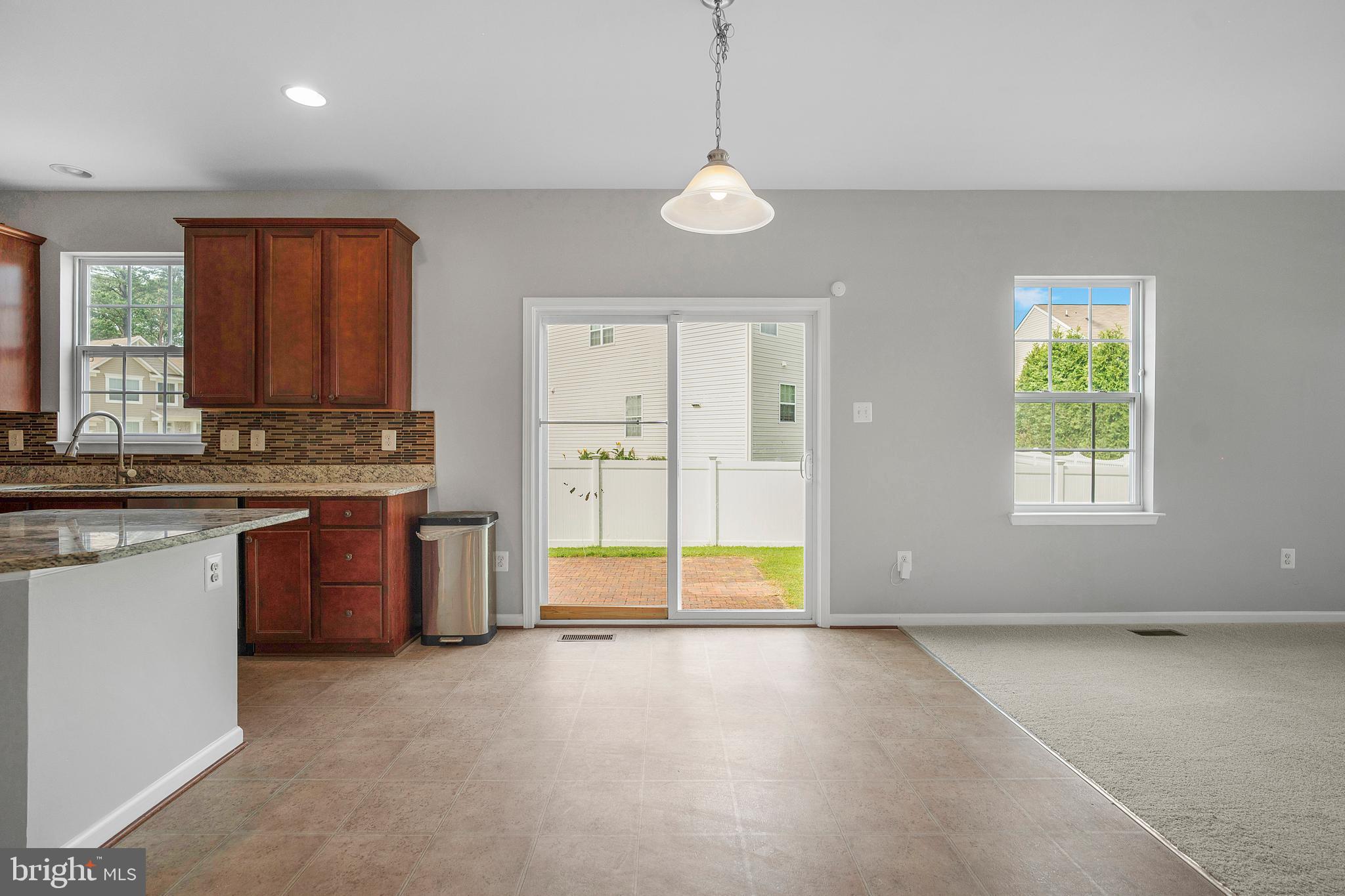 8205 Running Spring Circle Severn, MD 21144 - Photo 24 of 77 a view of a kitchen with a stove and a window