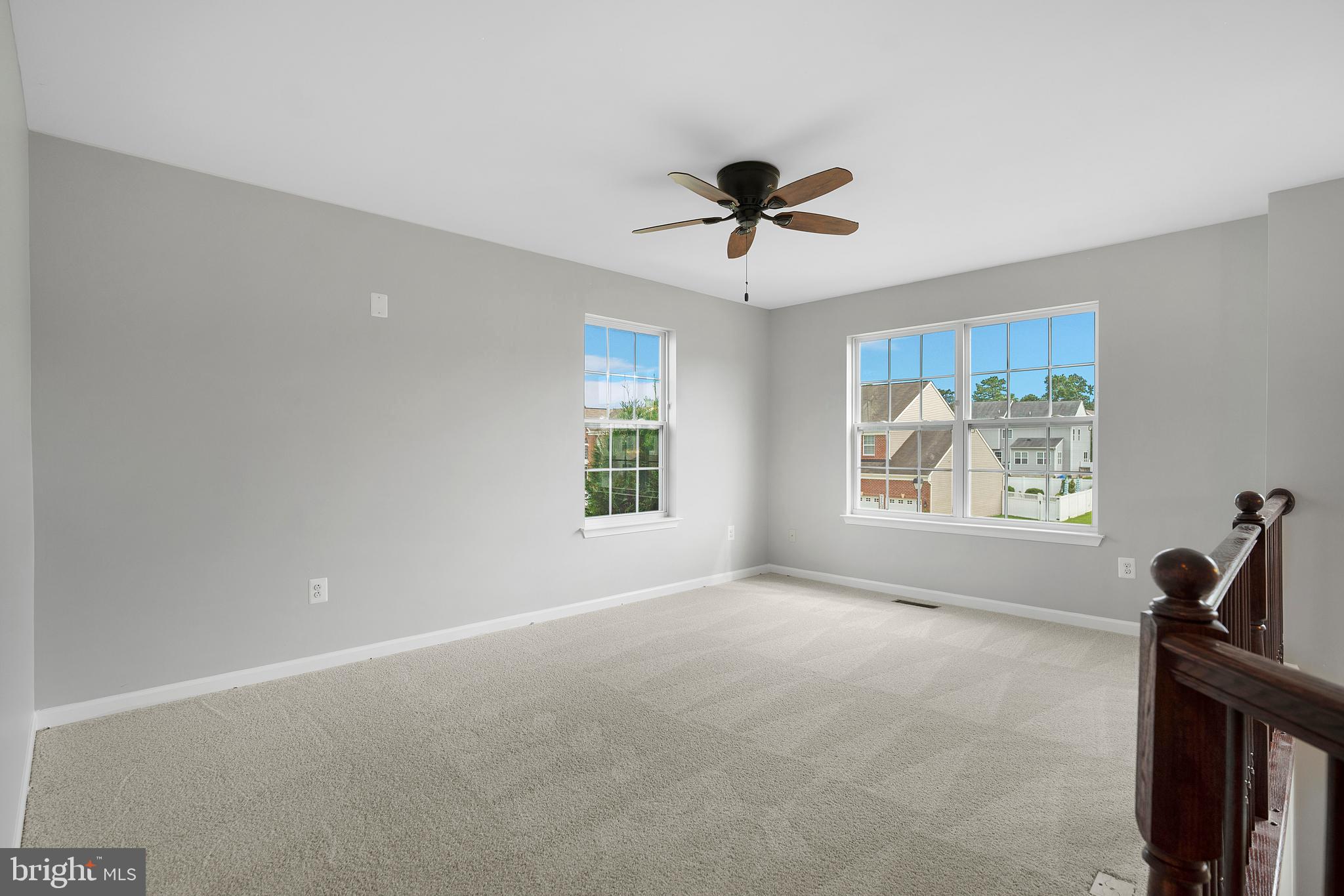 8205 Running Spring Circle Severn, MD 21144 - Photo 40 of 77 a view of a room with a window and a ceiling fan