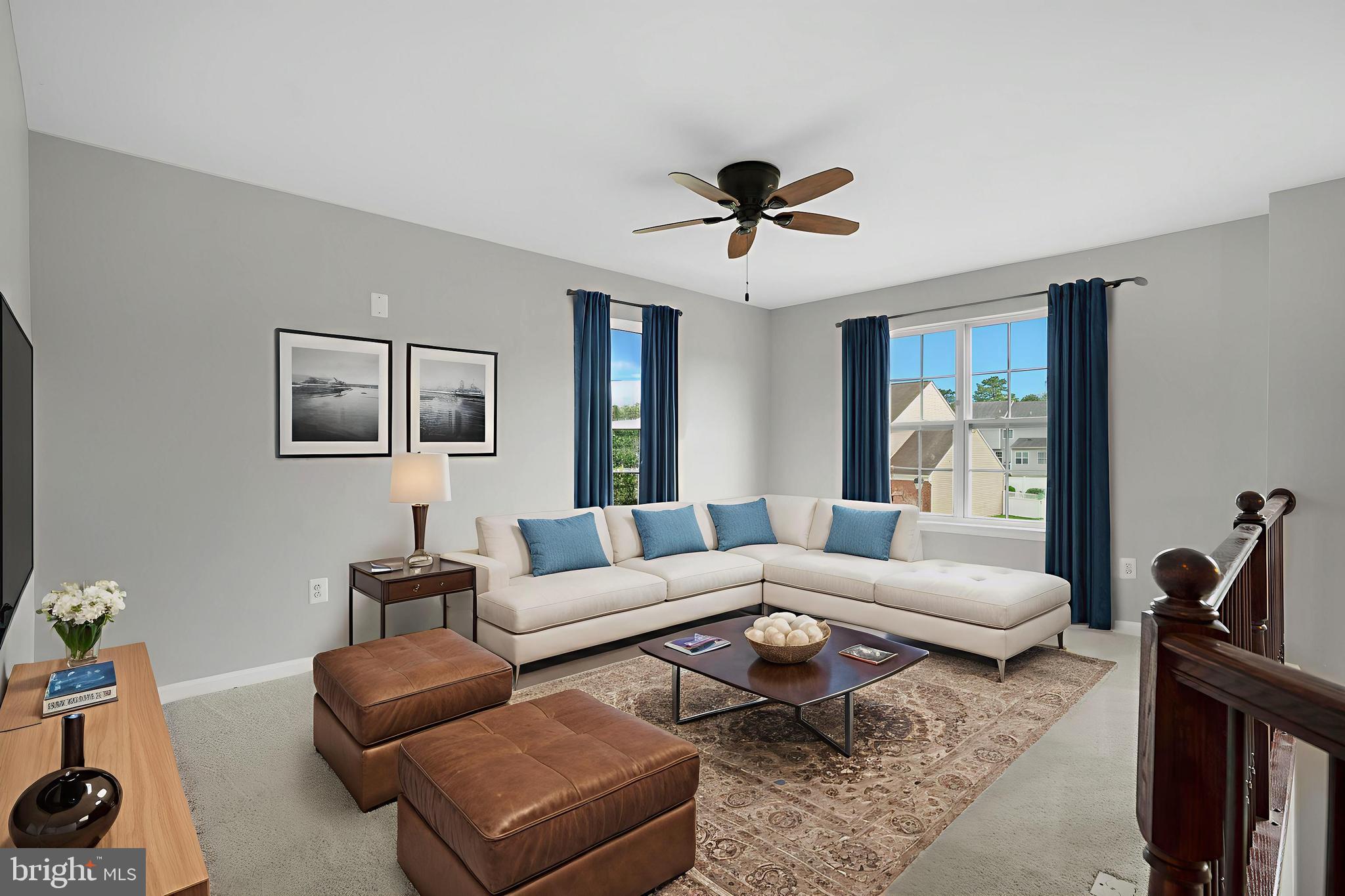 8205 Running Spring Circle Severn, MD 21144 - Photo 5 of 77 a living room with furniture a rug and a chandelier