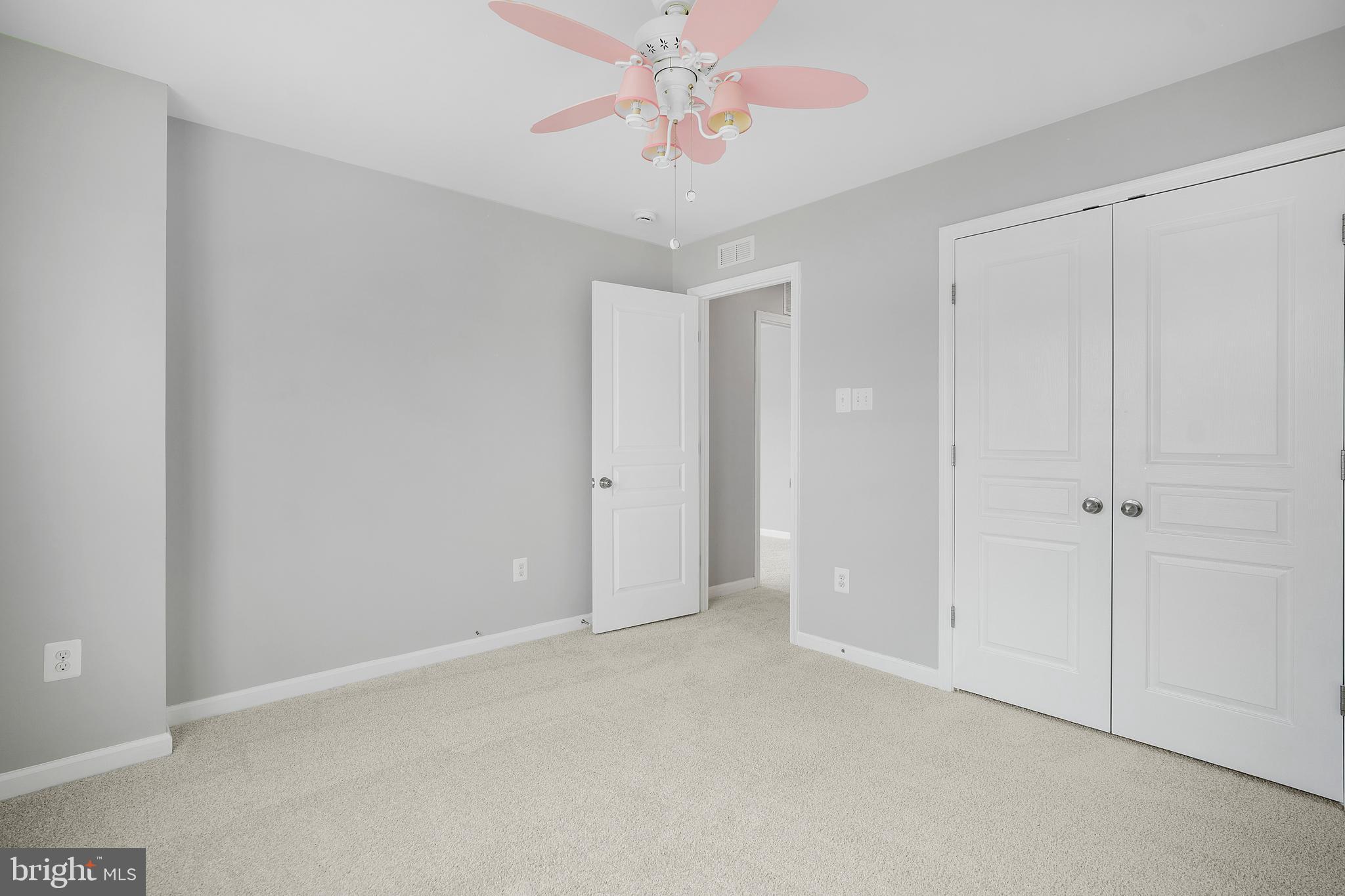 8205 Running Spring Circle Severn, MD 21144 - Photo 56 of 77 a view of an empty room and chandelier fan