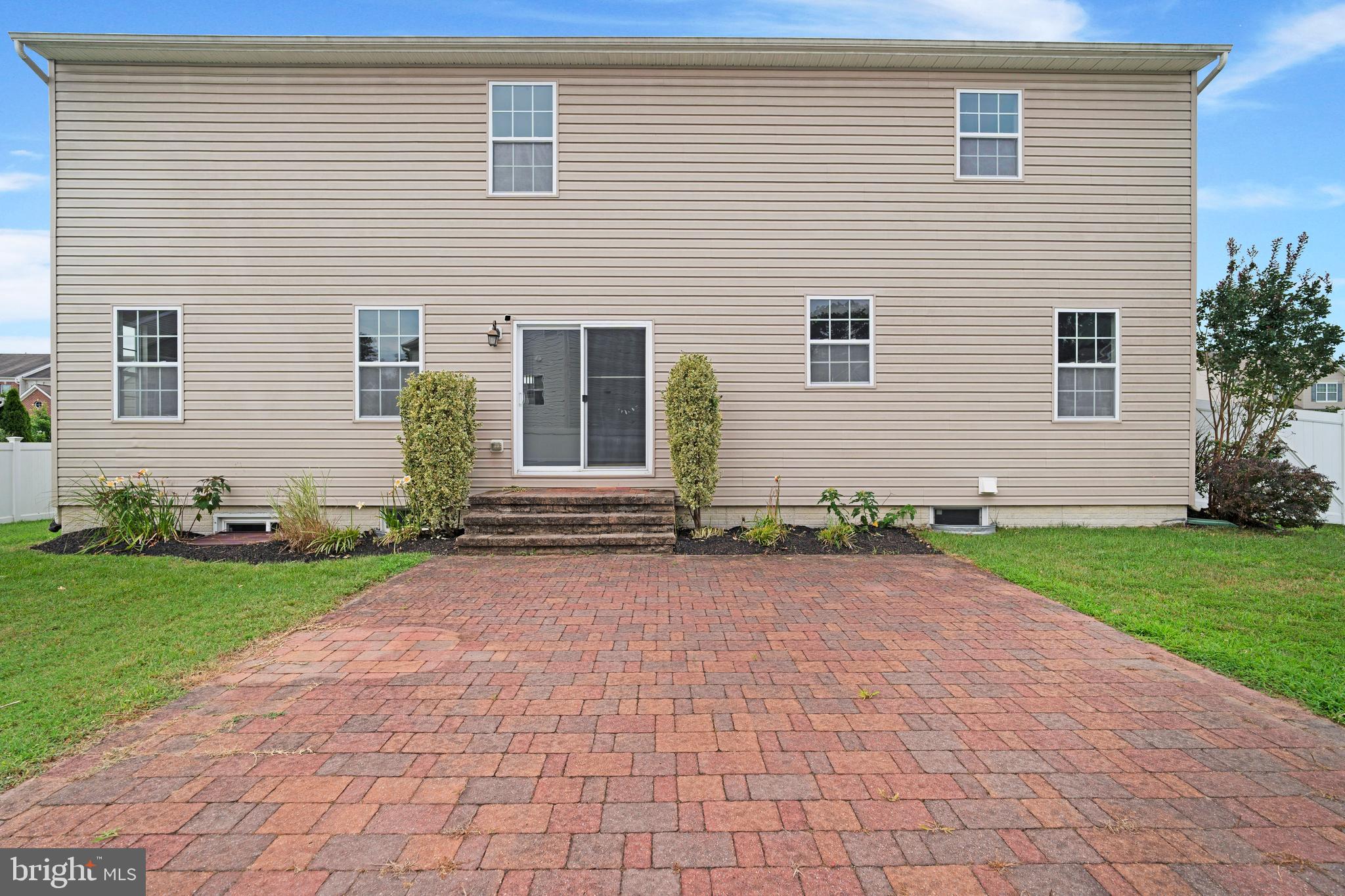 8205 Running Spring Circle Severn, MD 21144 - Photo 77 of 77 a front view of a house with a yard and a garage