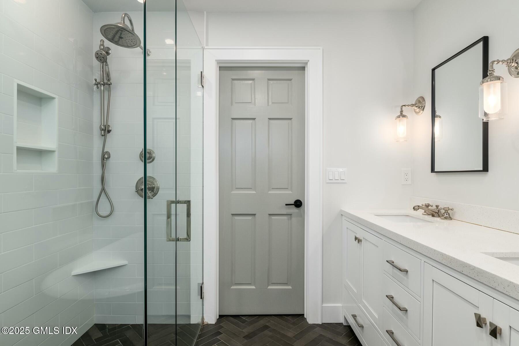 7 Griffith Road Riverside, CT 06878 - Photo 15 of 30 a bathroom with a double vanity sink mirror and shower