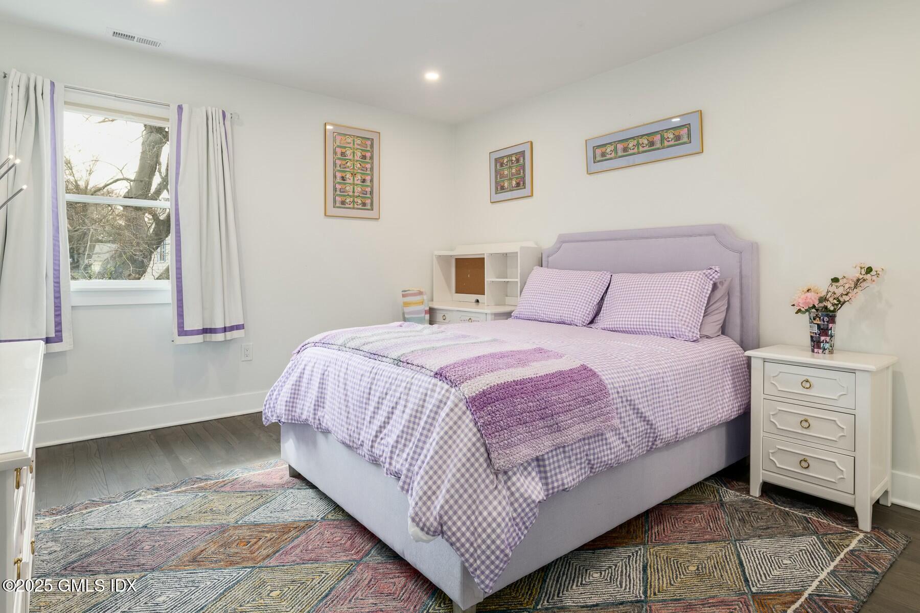 7 Griffith Road Riverside, CT 06878 - Photo 20 of 30 a bedroom with a large bed and a window