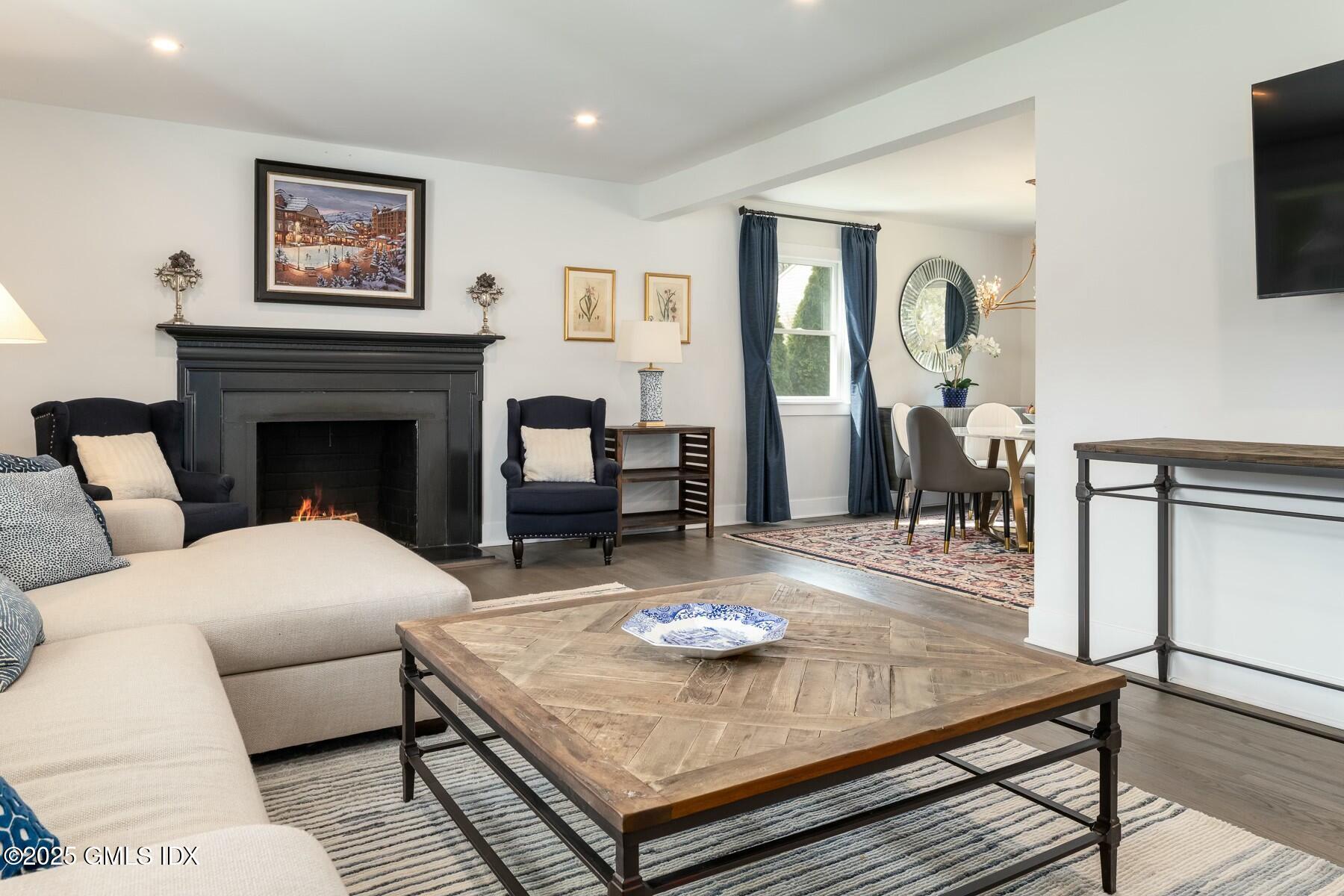 7 Griffith Road Riverside, CT 06878 - Photo 2 of 30 a living room with furniture and a fireplace