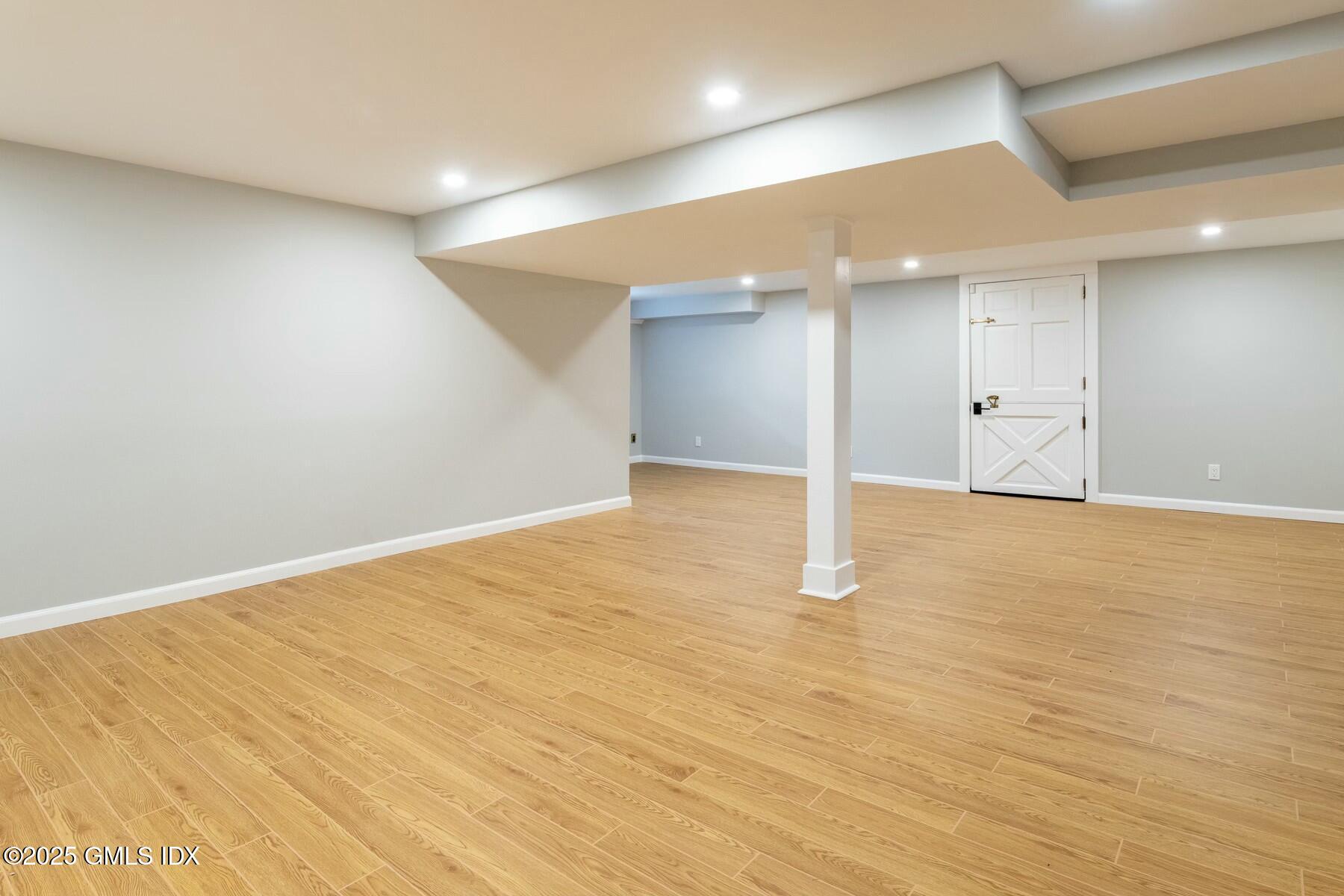 7 Griffith Road Riverside, CT 06878 - Photo 22 of 30 an empty room with wooden floor and windows