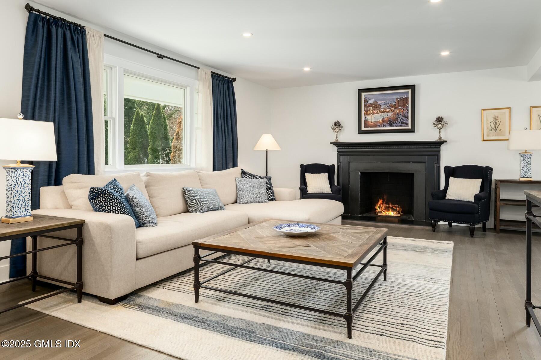 7 Griffith Road Riverside, CT 06878 - Photo 3 of 30 a living room with furniture and a fireplace