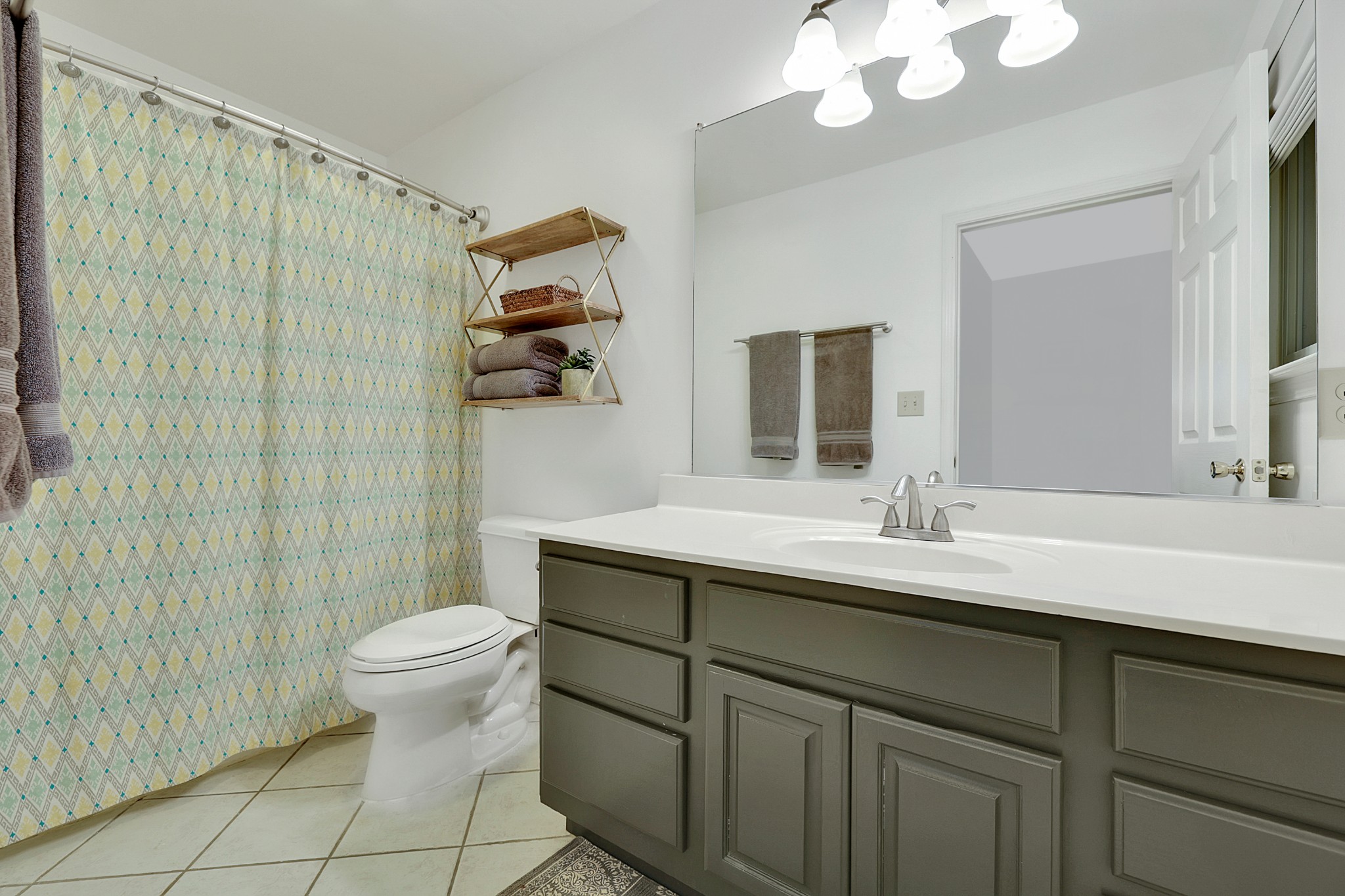 1820 Gravel Hill Road Columbia, TN 38401 - Photo 25 of 37 a bathroom with a granite countertop sink a toilet and a mirror