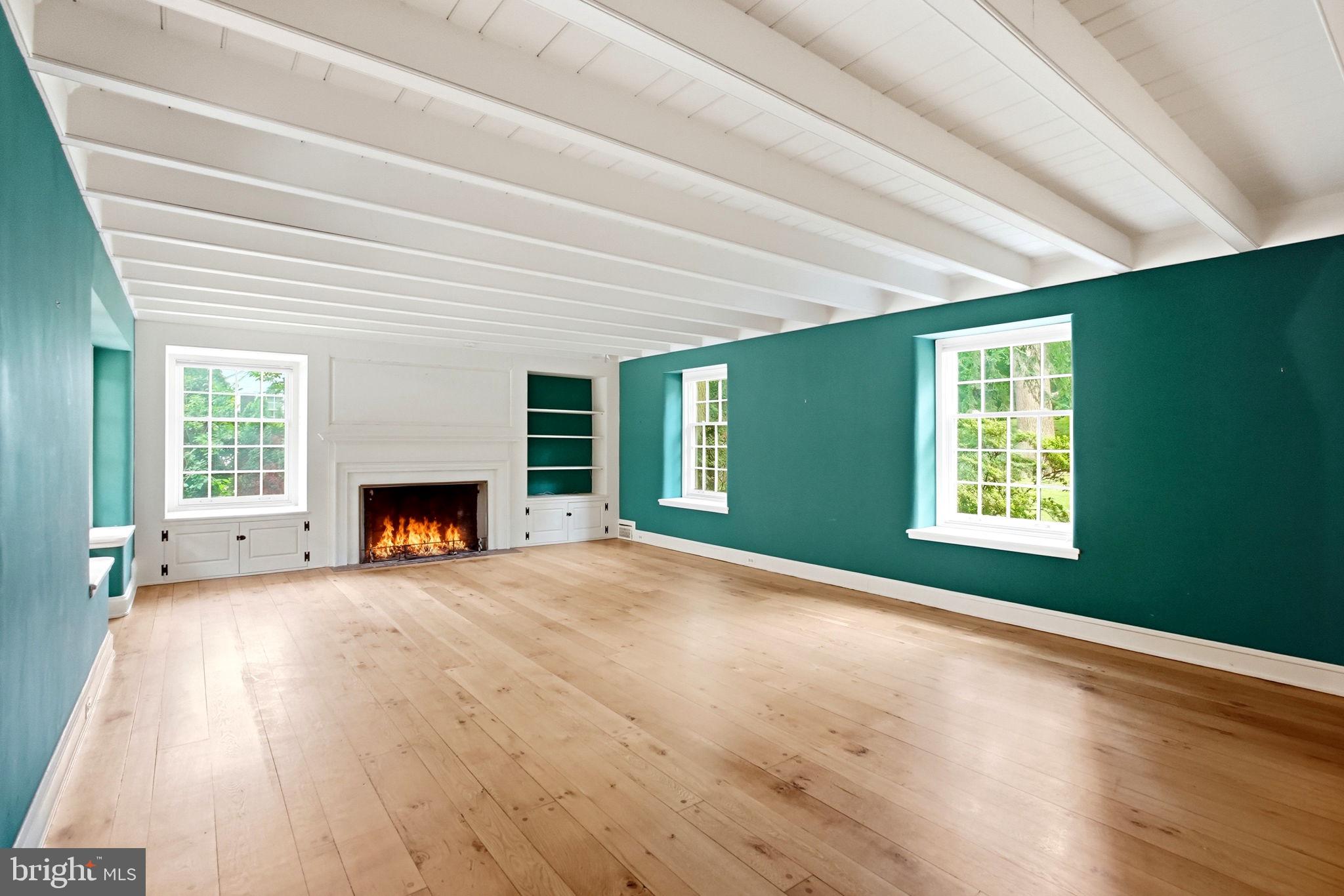 419 Riverview Road Swarthmore, PA 19081 - Photo 8 of 70 a view of an empty room with a fireplace and a window