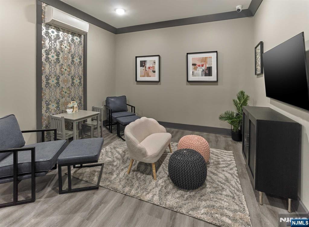 8 Tice Road, Unit 110 Franklin Lakes, NJ 07417 - Photo 22 of 29 a living room with furniture and a flat screen tv