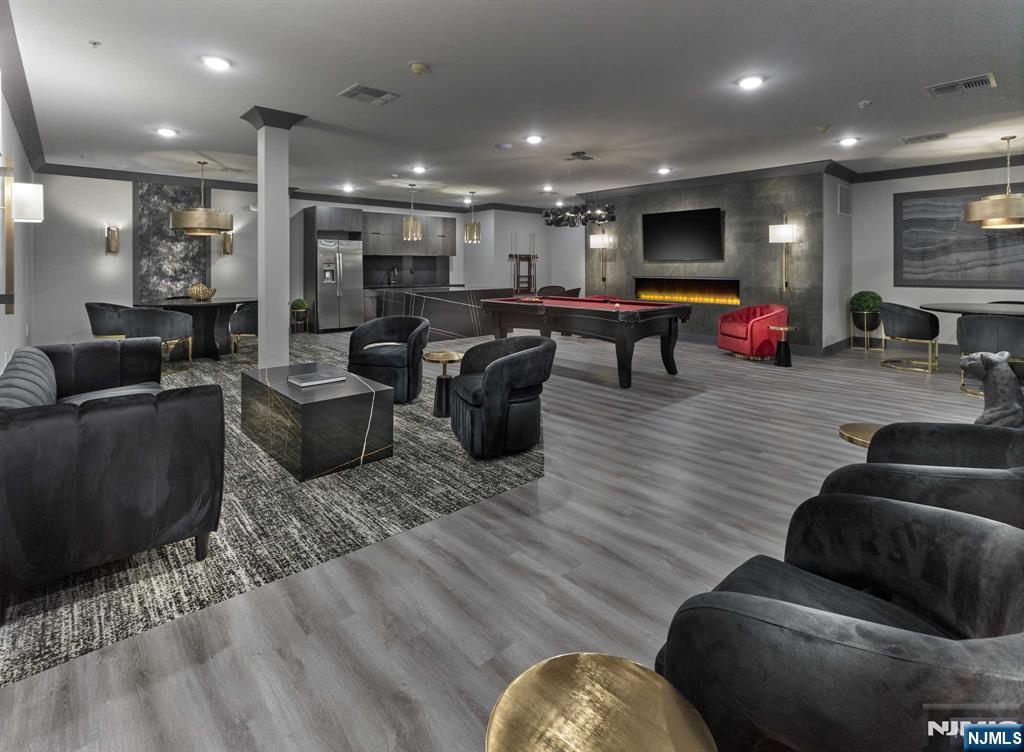 8 Tice Road, Unit 110 Franklin Lakes, NJ 07417 - Photo 23 of 29 a living room with furniture and a flat screen tv