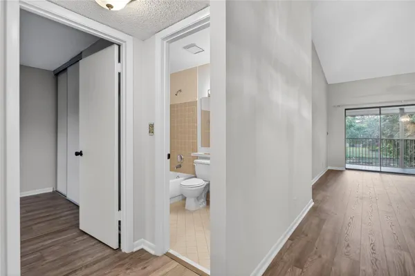 a view of a bathroom from a hallway