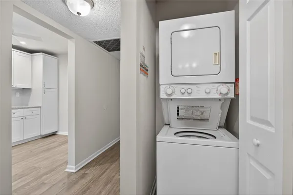 a view of washer and dryer with wooden floor