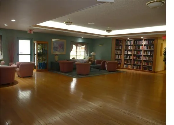 a living room with furniture and natural light