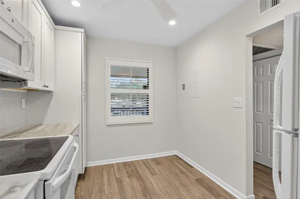 a view of kitchen and utility room