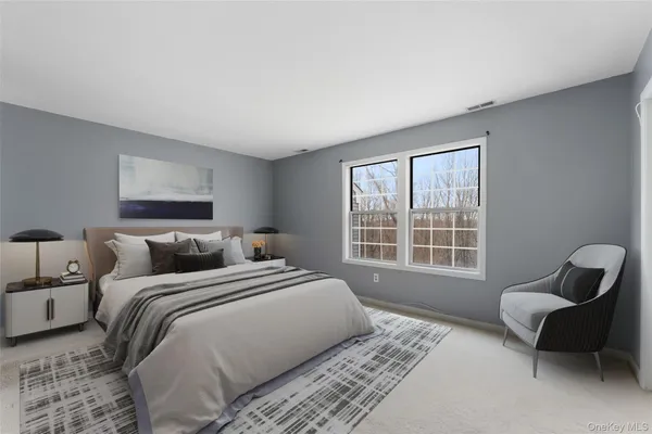 a bedroom with a bed and a couch